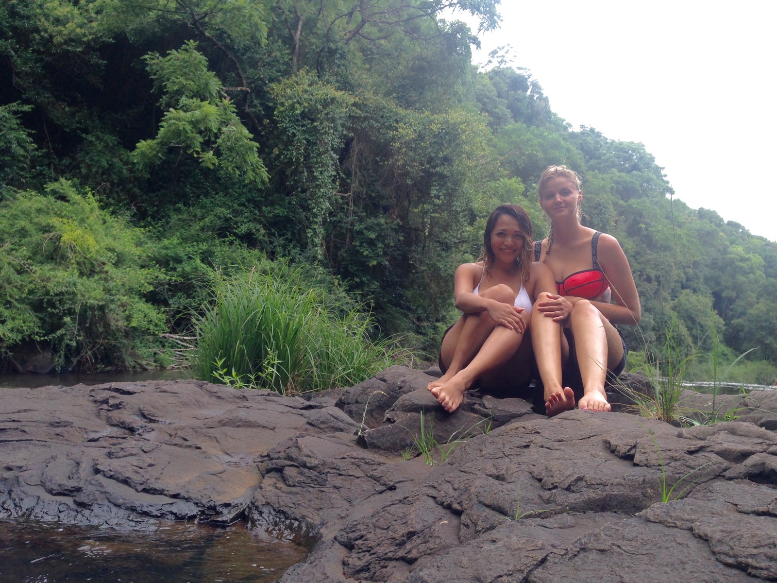 LuLu sitting with a friend by a river